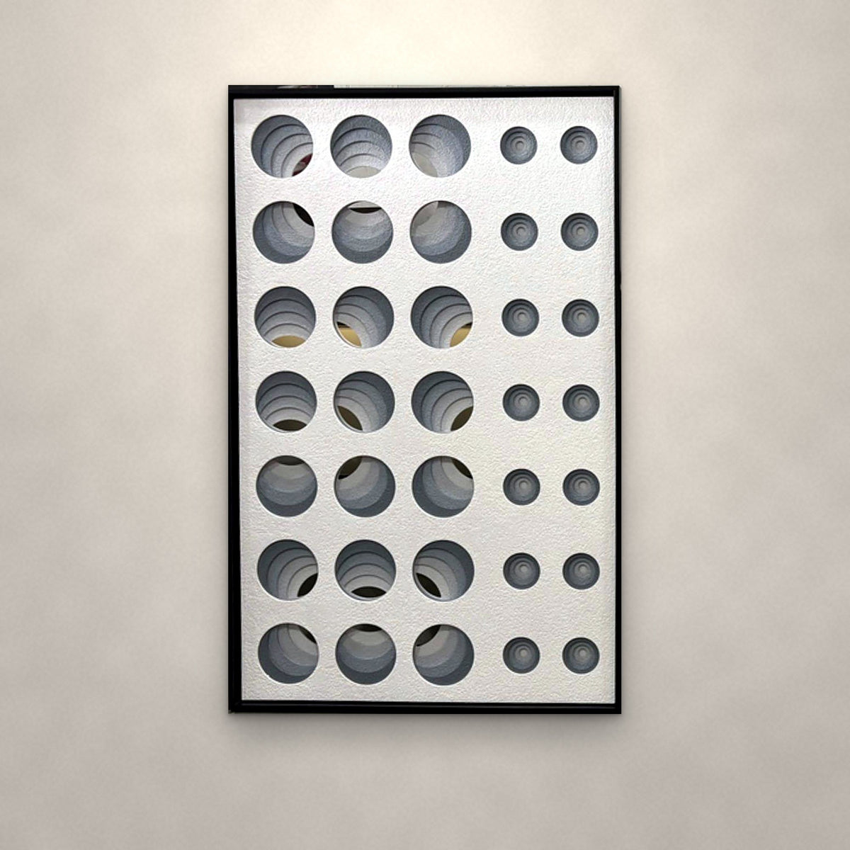 Orbit sculpted relief panel on an ivory plaster wall